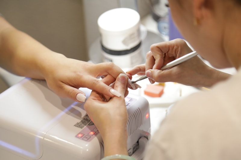 Nail technician at work