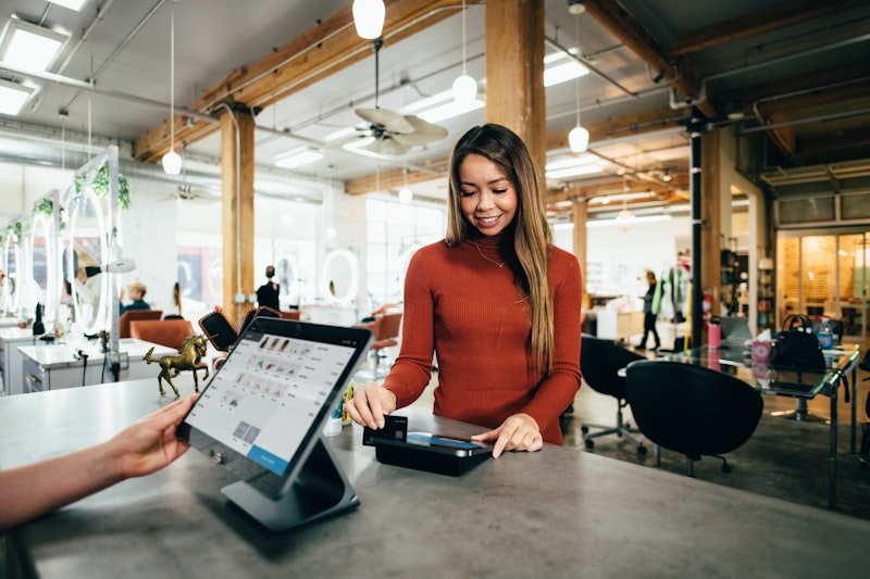 Small business owner at register